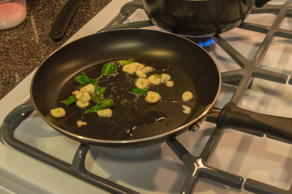 Frying garlic and curry leaves | thefoodiemiles.com