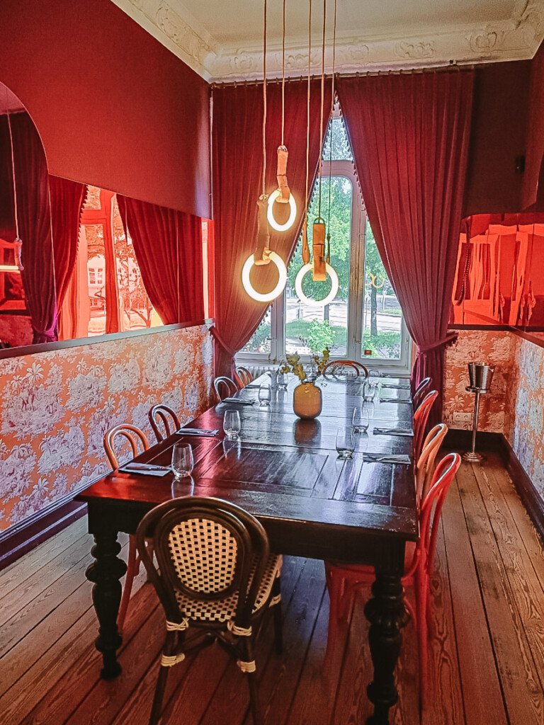 Morgenmuffel interior with bold red, modern, and alternative style