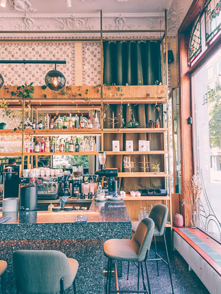 Inside Morgenmuffel Bar with cozy seating and decoration