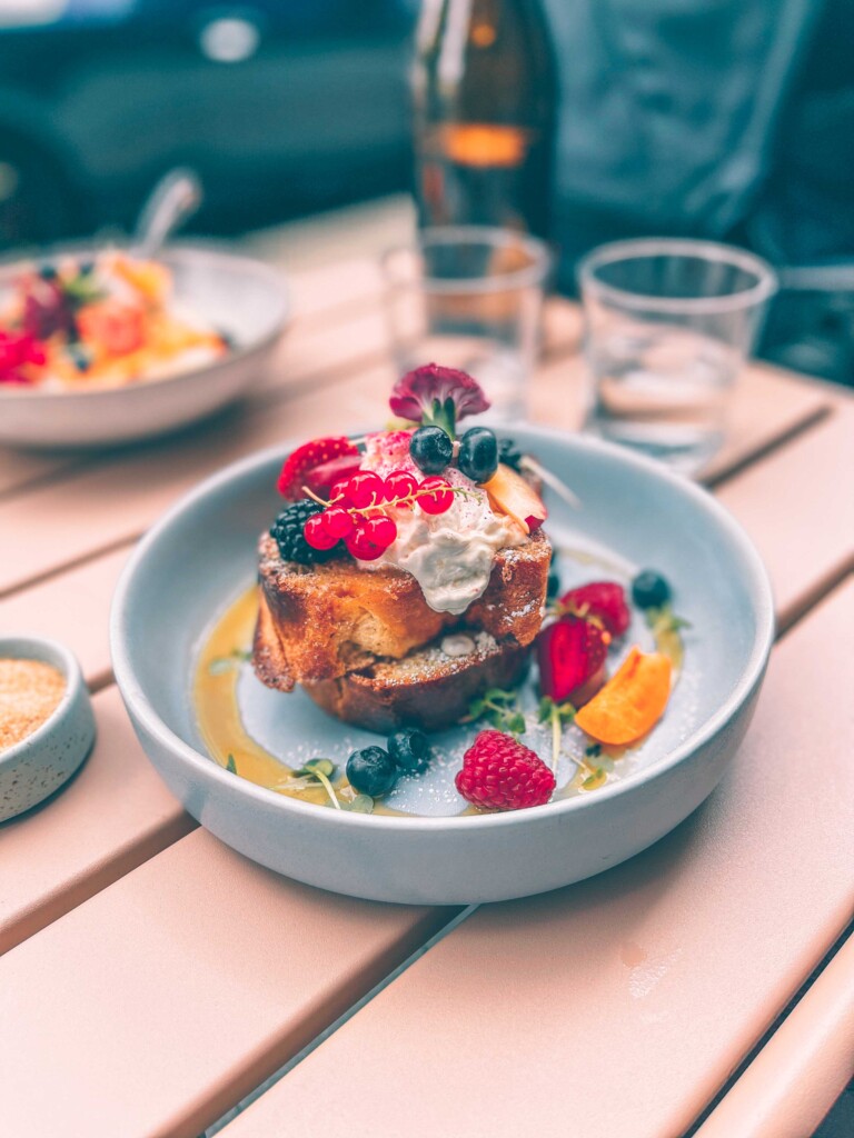 French toast breakfast at Marshall Street Coffee in Hamburg with syrup and fresh fruit.