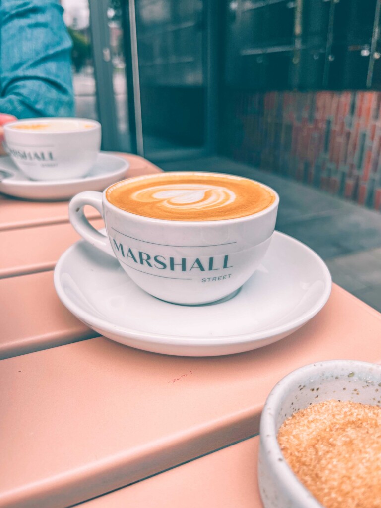 Cappuccino with heart-shaped latte art at Marshall Street Coffee in Hamburg.