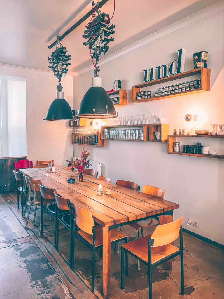 Inside Klippkroog with cozy seating at wooden tables