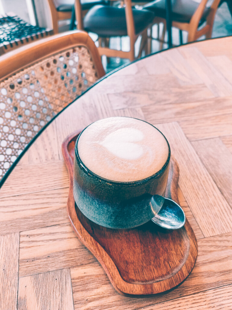 1407 Breakfast Club coffee with a heart-shaped latte art design on top