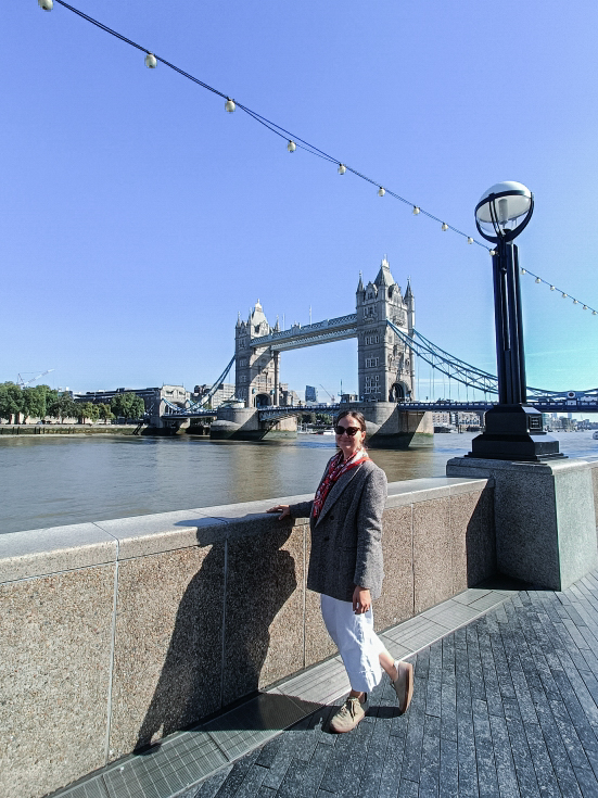 Yulia posing with Tower Bridge in London in the background.