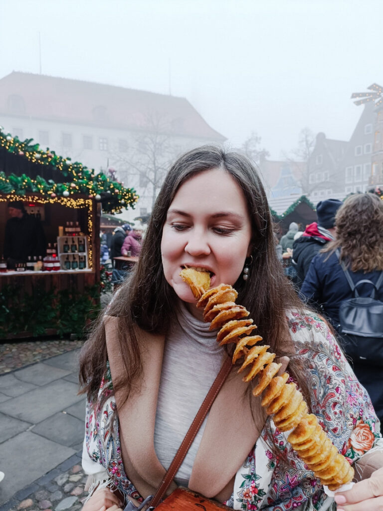 eating potato dish at Lüneburg Christmas Market