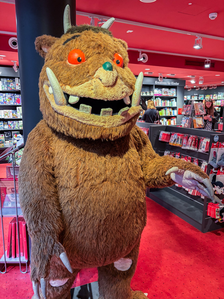 A statue of Grüffelo in the kids section at dussmann in Berlin